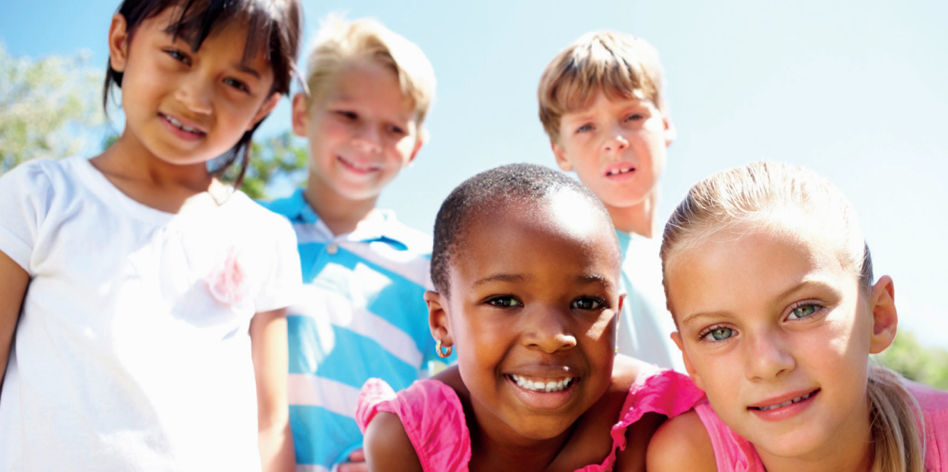 A group of happy, culturally diverse children of primary school age