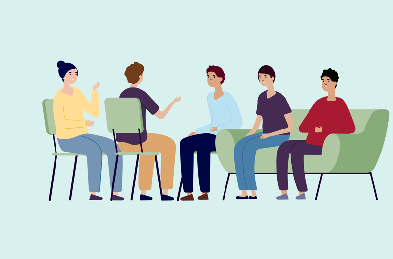 5 people sitting on chairs and having a discussion